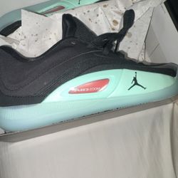 Jordan Zion 4 basketball shoes in the Black/Bright Crimson/Particle Grey/Mint Foam colorway