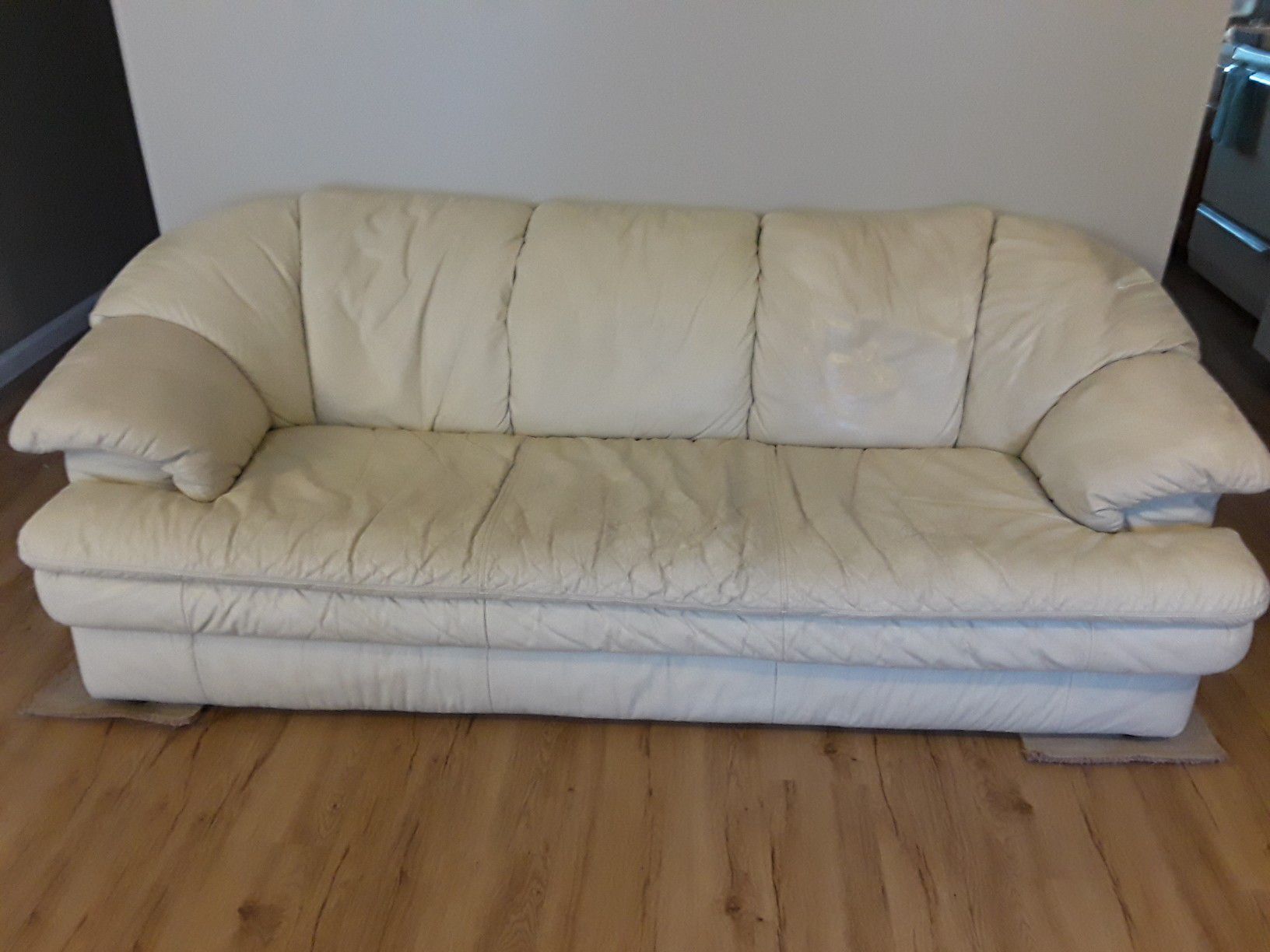 White living room leather couch.