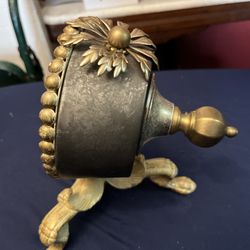 Vintage metal clock keeps time