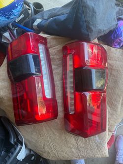 Ford OEM tail lights w/ sensor 2026