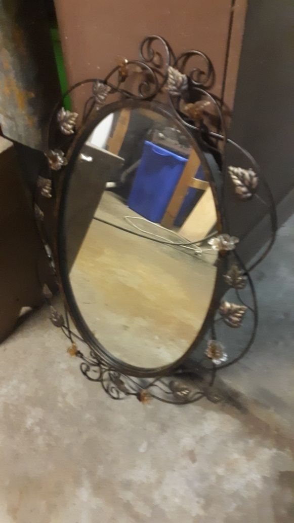 Oval mirror with glass flower metal decor