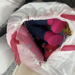 Kids sheets pillow cases and bag of toys