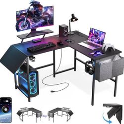L Shaped Gaming Desk With Desk Extender, LED lights, power outlets, and monitor stand