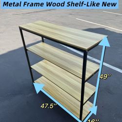 Metal frame shelving unit with wood shelves. Like new 
