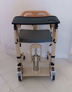 Hydraulic lift transport commode chair, adjustable yellow steel, with footrest and dining tray, 200 kg capacity, 4 wheels,