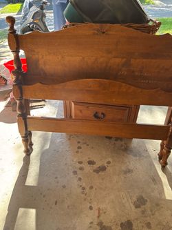 Wooden twin sized headboard and metal frame