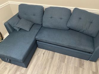 Beautiful blue sectional sleeper and storage