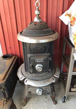 Vintage Pot Belly wood stove Comfort brand chrome accents. 54” H x 24” D  inc chrome. for Sale in Olympia, WA - OfferUp