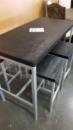 Black counter height table with 4 stools