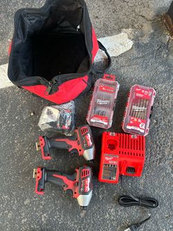 Milwaukee impact charger,battery,2 drills and bag