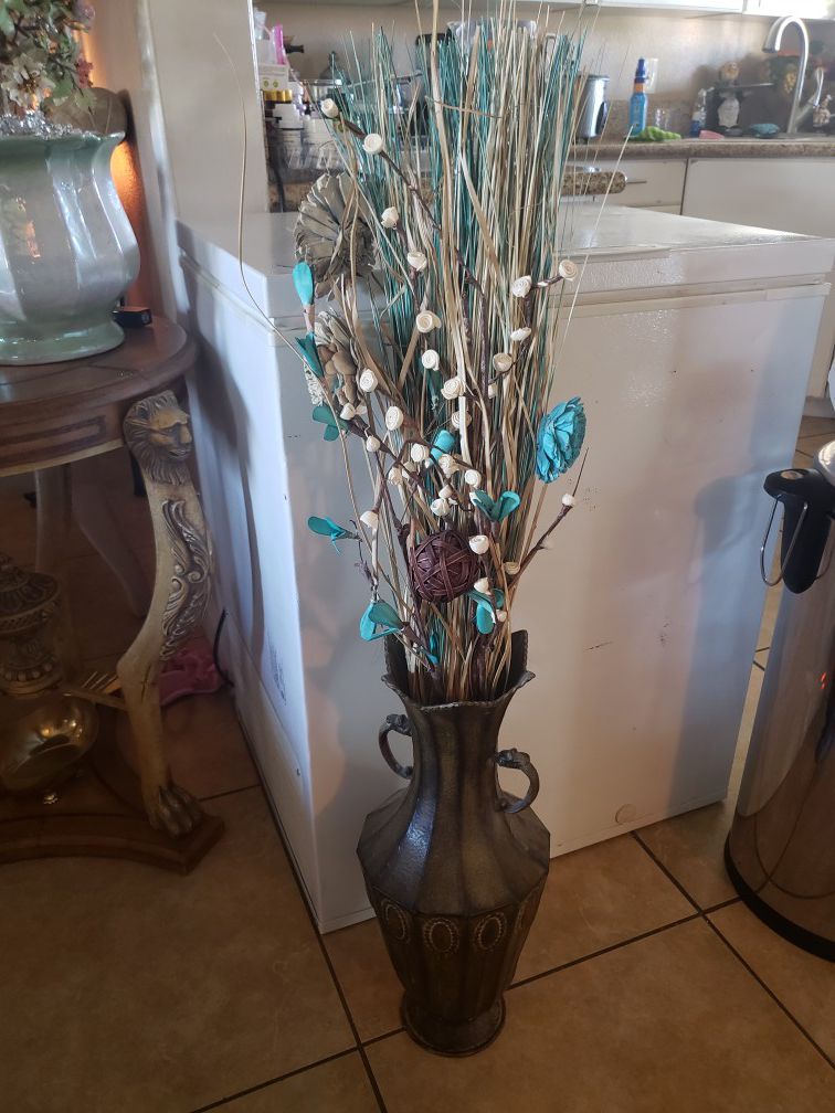 Metal vase with flowers