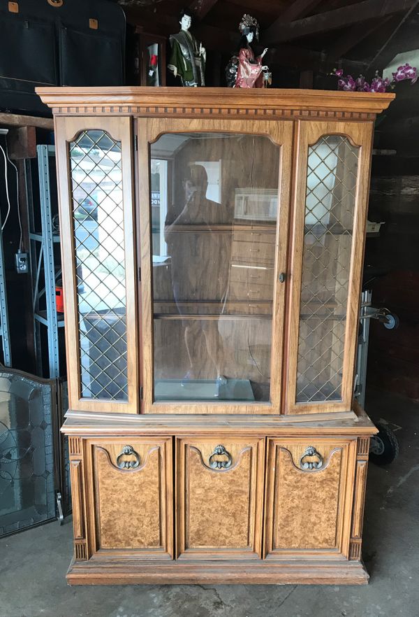 China buffet with glass doors and vintage handles. It comes