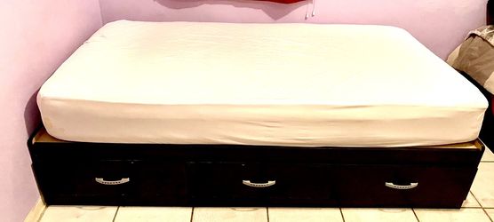 Two twin beds frames with three storage draws each and two NEW mattresses twin size