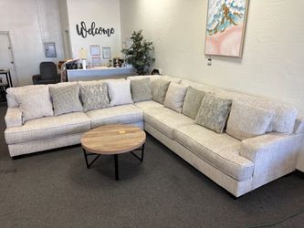 Light Gray L-Shaped Sectional Sofa with Pillows