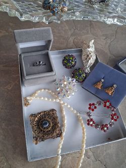 1 silver ring with blue sapphire stone, 3 3 Brooches, 1, green red clip ea 1 angel earrings,  1 fresh water pear necklace 1 hair clip