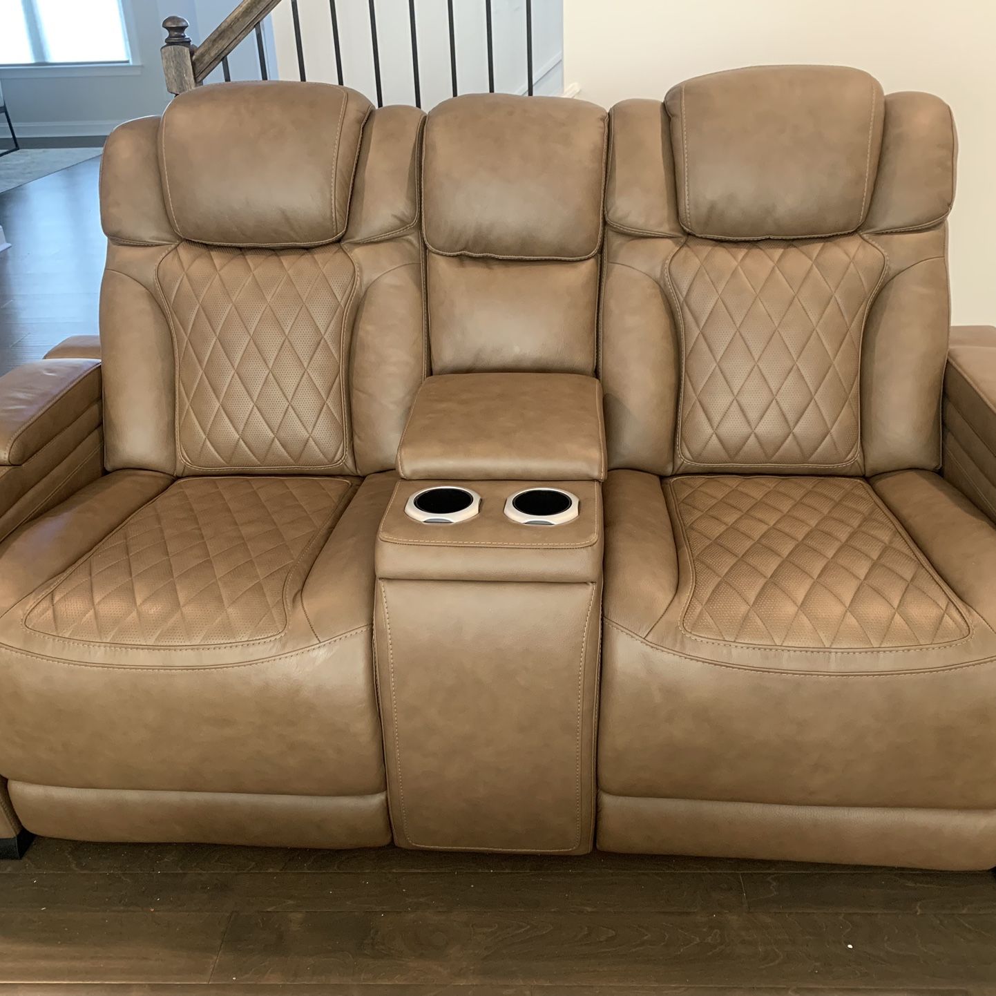 Power recliner with controls and wireless charging.