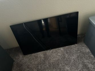 40 inch TCL ROKU TV  W/  TV STAND