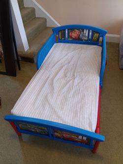 Toddler Disney car bed with mattress.
