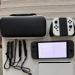 Nintendo Switch OLED with extra controllers + case