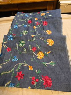 Light jean material with Floral embroidery.   60" wide x 50" long.  07156PR