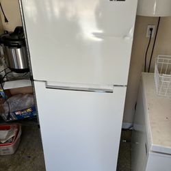 Refrigerator. Dent On Door 
