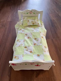 Doll bed with bedding