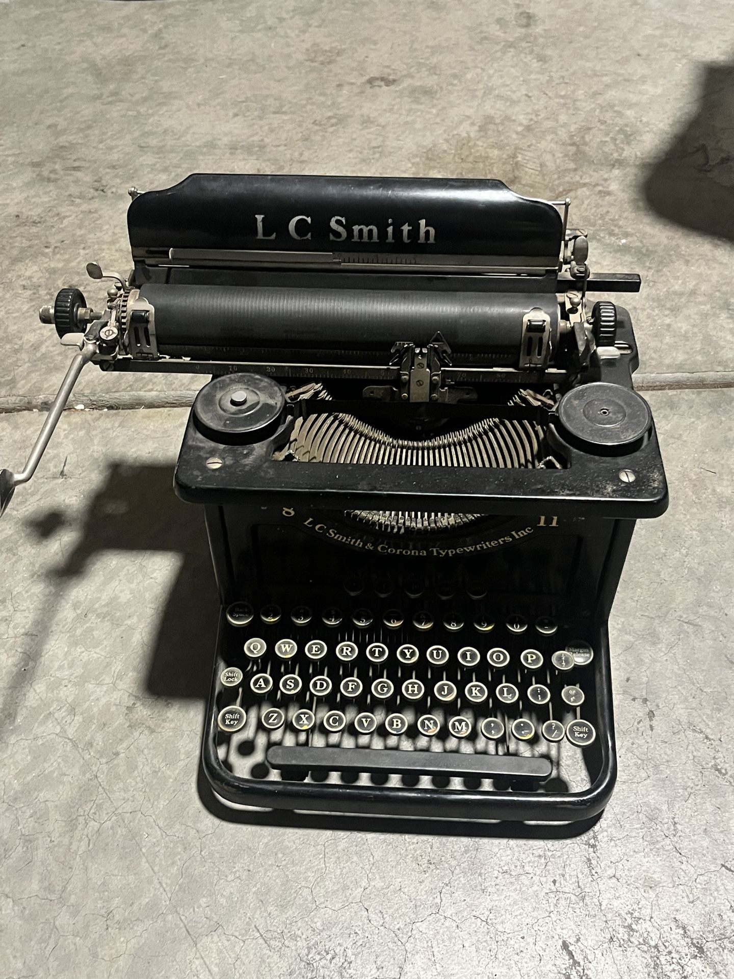 Antique 1930’s LC Smith 8 11  typewriter has 5 rows on the keyboard.  The standard key QWERTY Keyboard plus the additional top row for accounting 