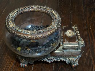 vintage novelty fishbowl,  stack of antique books. faint, raised, or impressed crescent mark on the back of the base indicates it Bradley & Hubbard