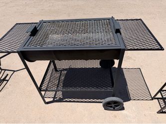Barrel grill with wheels and a bottom shelve