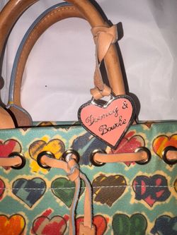 THE RAREST Baby Blue Y2K vintage Dooney in excellent condition. Interior is excellent! Comes with Crossbody Strap & heart tag. 7” length x 12.5” width