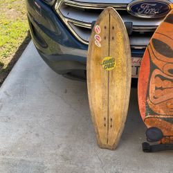 Green and black Santa Cruz skateboard cruiser