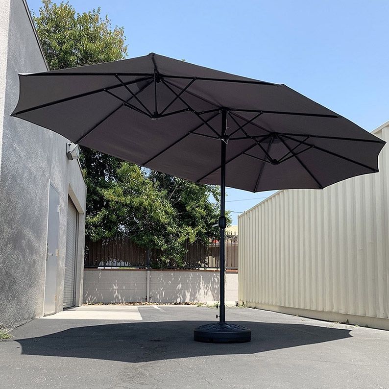 $130 (New in box) Large 15ft double sided outdoor umbrella w/ 65 lbs plastic weight base (red/gray)