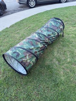 a collapsible camouflage pop-up play or pet tunnel,