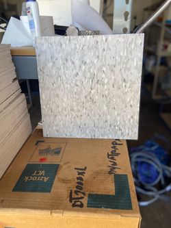 Floor tile 18 boxes. Light gray. 75 bucks