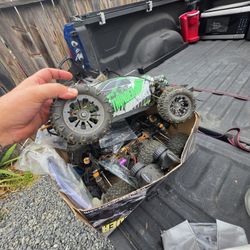 Box full of r c car parts