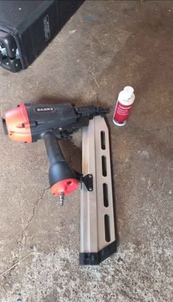 Framing nailer with nails and tool oil