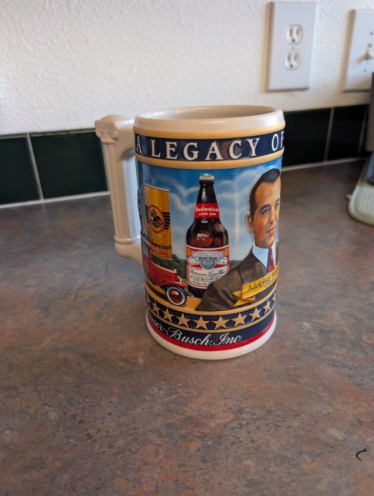 #C2 2003 Budweiser "Legacy of Quality" beer stein featuring Adolphus Busch III.
This beer stein is about 6 in tall
