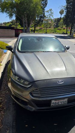 2014 Ford Fusion Hybrid – Clean Title – PNO Paid – New Tires