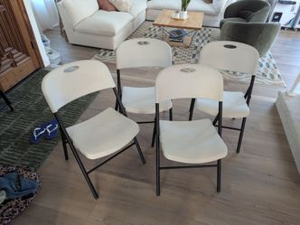 4 Amazon basics White plastic folding chairs 350 pound capacity