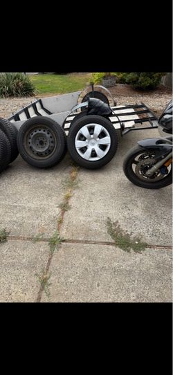 NEW TIRES ON RIMS/ w hubcaps