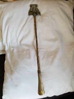Vintage brass long handle CMRYU shoehorn.