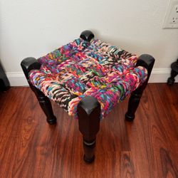 Black & rainbow weaved foot stool / plant stand