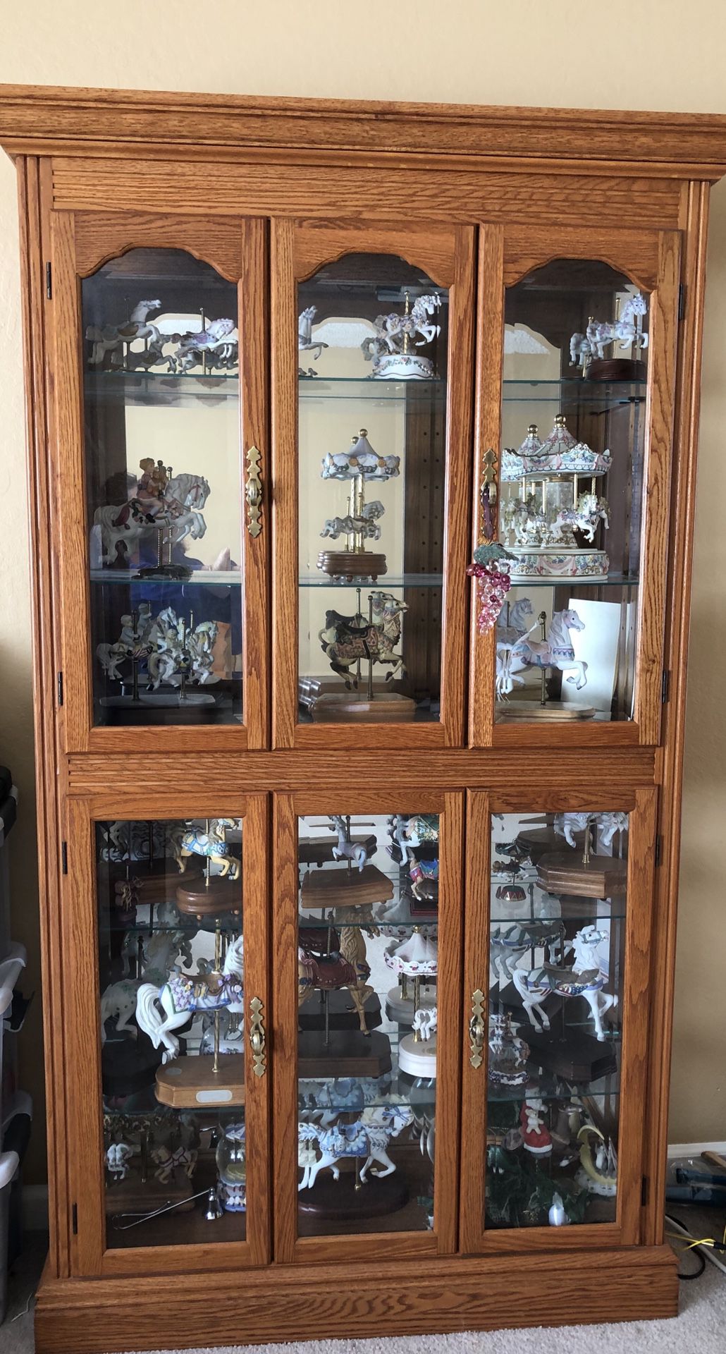 Cabinet and 15-20 Carousel Figurines / Music Boxes
