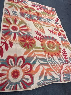 Patio out the door, red and orange rug 6 x 9