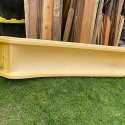 Plastic slide with anchor