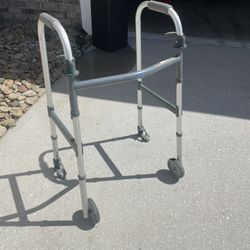 Invacare Adult Walker. with wheels. foldable. padded handles 