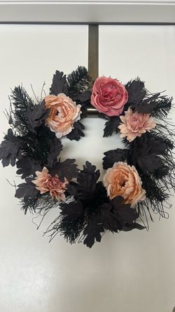 Black wreath with flowers