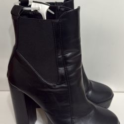 Black ankle boots with thick heels, also known as ankle boots with platform and block heel