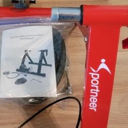 Two SPORTNEER  BIKE TRAINERS 