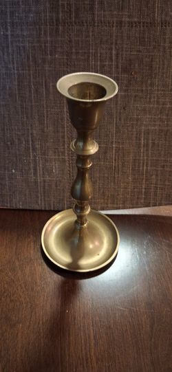 Single 8 1/2 inch high candle stick.